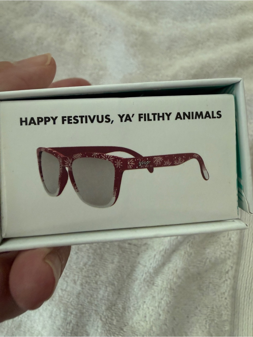 Goodr, “Happy festivus, ya filthy animals!” Polarized red snowflake sunglasses